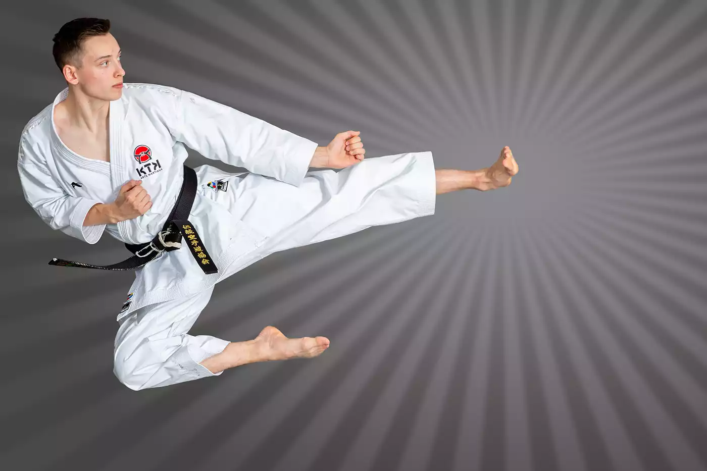 KTK Martial Arts sensei performing a flying kick. Sport photography by Jeffrey Meyer